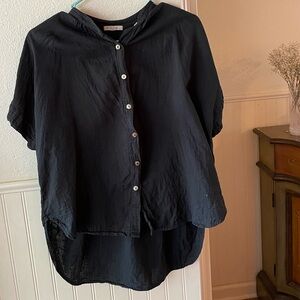 It is well black button down shirt, size medium